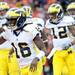 Michigan junior quarterback Denard Robinson celebrates his second touchdown during the second quarter at Memorial Stadium on Saturday afternoon. Melanie Maxwell I AnnArbor.com